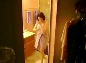 Hidden cam clip with my ex wife undressing and taking a sho image photo