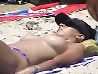Nice voyeur video of delicious breasts and boobies tanning on the beach
