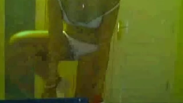 Cheerleader cutie changes her clothes on a webcam