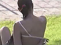 My voyeur video of redhead girl taking off her bra in the public park