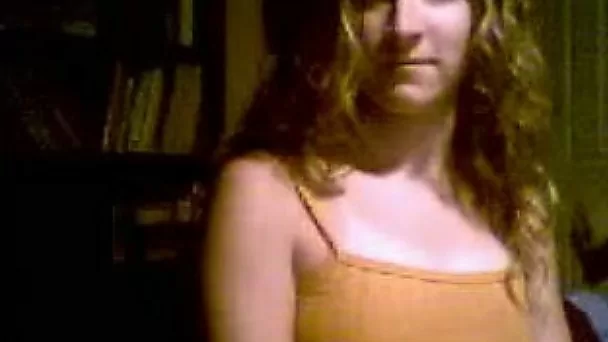 Captured webcam video of one amateur chick showing off her boobs and ass