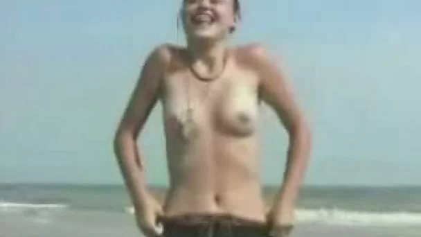 Adorable brunette agreed to get naked on the beach for me