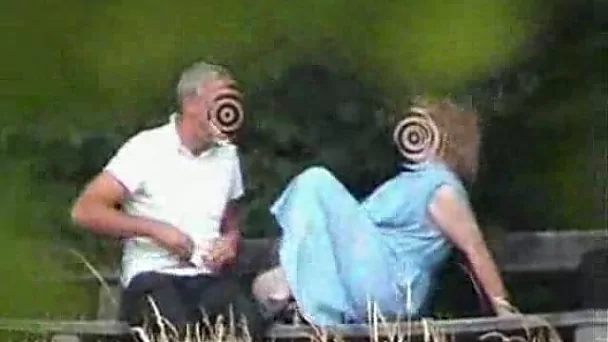 Two mature amateur people pleasing each other in public