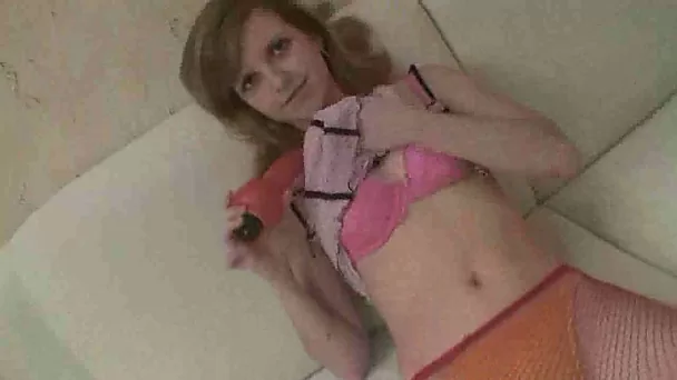 Very skinny teen whore dildoing herself on the couch