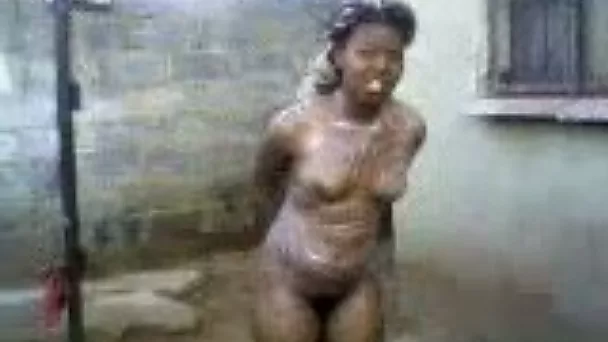 Two black bitches wash their marvelous bodies outdoors