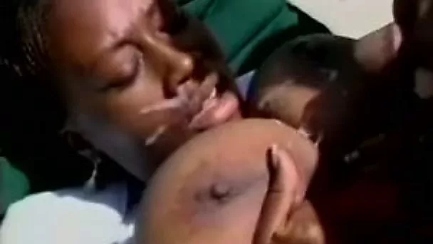 Busty ebony woman gets her titties fucked by massive cock