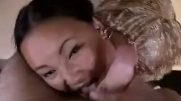 He jerks off his dick while she tickles his balls with her tongue