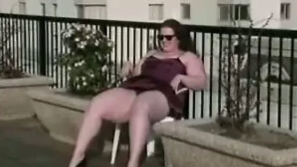 Watch this pretty and cute fat woman outside flashing tits