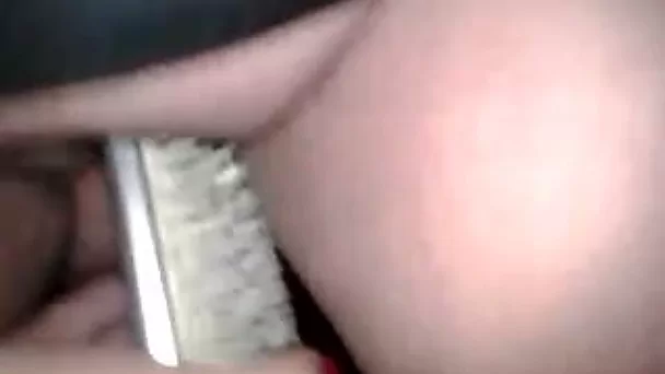 Disgusting chubby harlot pokes her muff with hairbrush