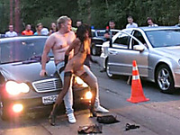 The crazy stripper girl in Russia on the car race show