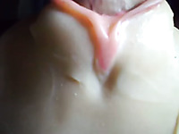 A plastic pussy toy getting used closeup and jizzed