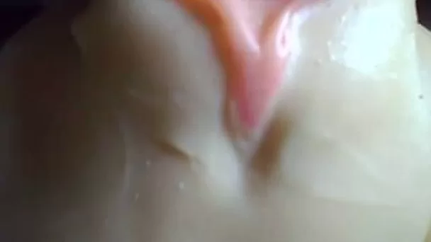 A plastic pussy toy getting used closeup and jizzed