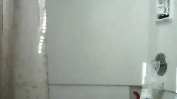 Magnificent tanned beauty soaps up her big booty in shower