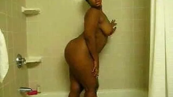 My extremely curvy ebony girlfriend takes shower rubbing her ass