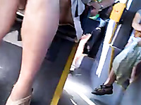 The sexy legs of a hot milf businesslady on the bus