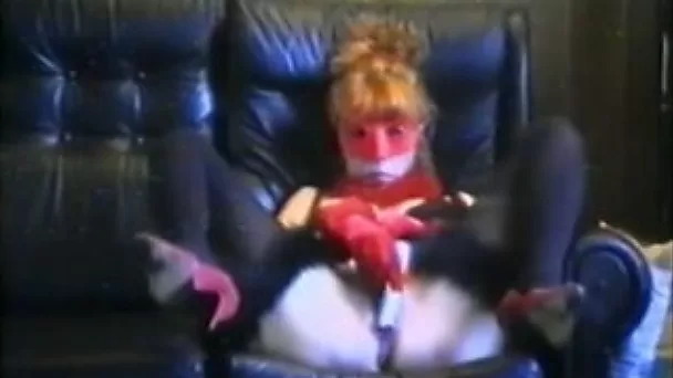 Mature redhead wife masturbates on the couch in the mask