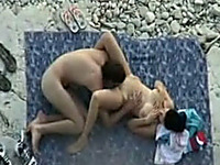 Spying on horny couple having hot sex on the beach