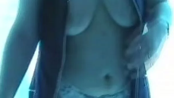 My sexy wife in the garage flashes her tits on the video
