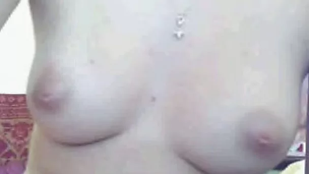 Shy amateur girl on webcam flashes her tits for a long time
