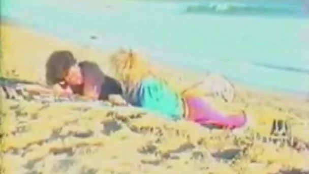 Slutty chick gets her twat licked and banged on a beach in retro vid