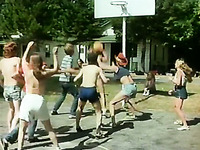 Stunning retro scene with coeds playing basketball outdoors