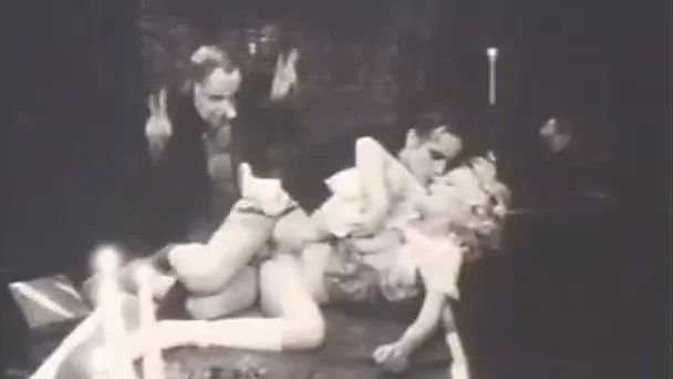 Slutty woman gets fucked by masked dudes in retro clip