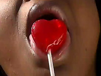 Ebony hussy sucks a lollipop outdoors and takes a ride on a BBC