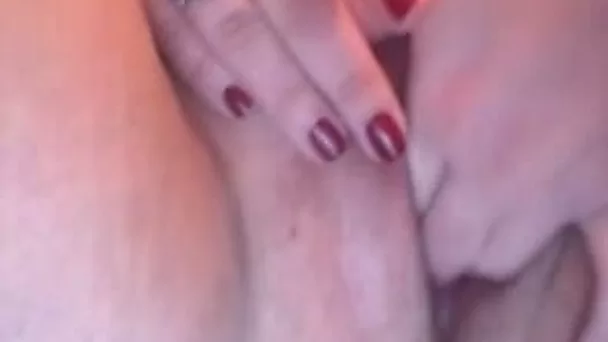 Fat woman sits in front of the web cam and rubs her pussy