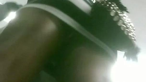 Saucy black MILF from the ghetto and her sexy upskirt