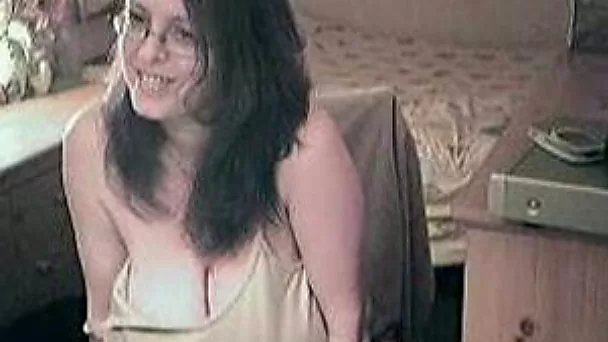 Nerdy brunette wifey showing off her big juggs on webcam