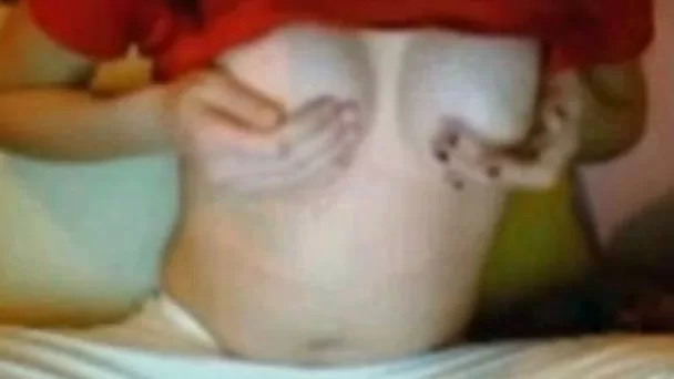 This raven haired nympho shows off her nicely shaped breasts
