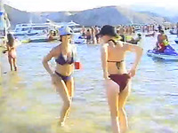 Hot video with a mature blonde flashing her nude body on a beach