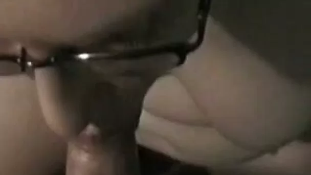 Sucking her boyfriend's cock in her bedroom on camera