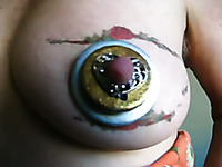 Tattooed breast of my wife looks like an eye with that jewelry