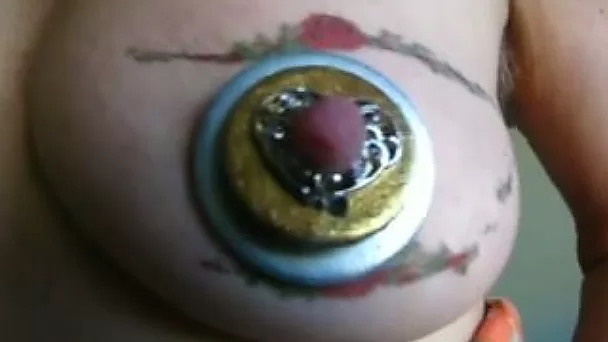 Tattooed breast of my wife looks like an eye with that jewelry