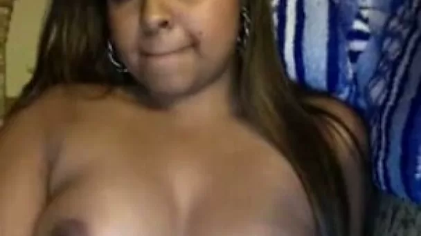 Cute and sexy brown skin sweetie flashes her boobs on webcam