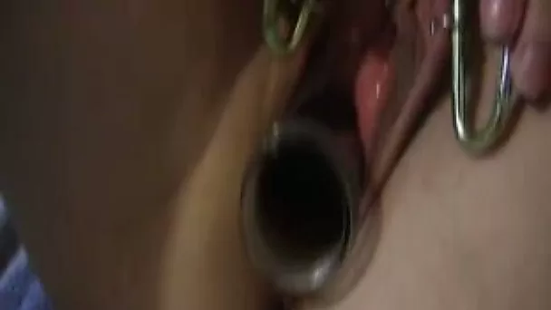 Pierced shaved pussy stuffed with big glass bottles
