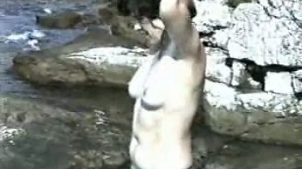 Bodacious brunette wife gets naked on rocky beach