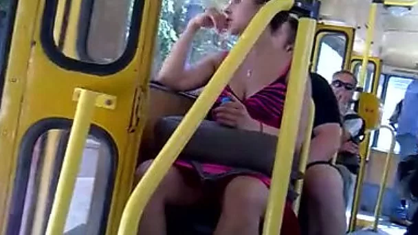 Super sexy chick in pink dress is sitting with her legs spread