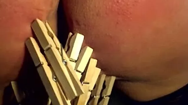Nasty filthy white whore got her pussy lips clammed with cloth pins