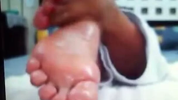My wife demonstrates her pedicured oiled feet for the cam