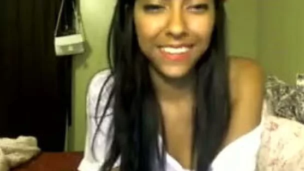 Skinny latina girl with small tits takes off her clothes on webcam