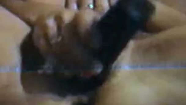 Homemade solo scene with my wife toying her hairy cunt