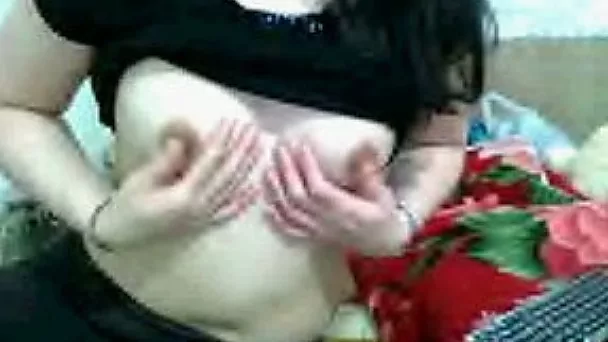 Slutty Asian woman demonstrates her natural tits for the cam