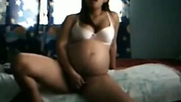 Pregnant Latina charmer with lovely ass masturbates on webcam