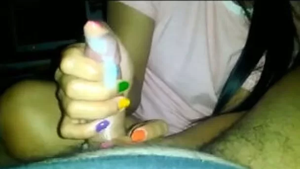 Thai teen prostitute with different nail colors gives me handjob