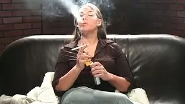 Hot brunette girlfriend fully dressed smokes a cigarette