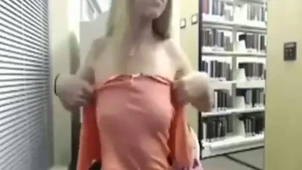 Naughty blonde strips in public library on web camera