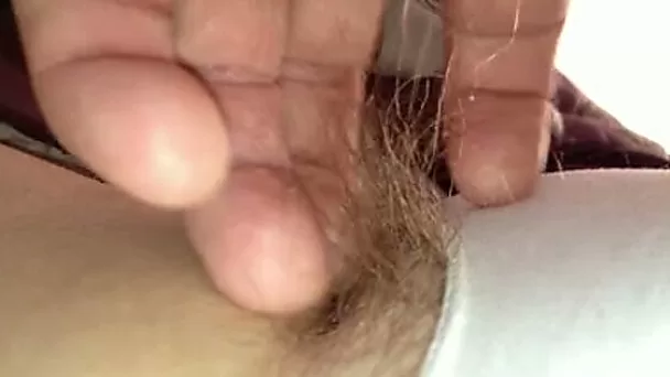 I just love playing with her long pubic hair through her pantie and rub her twat