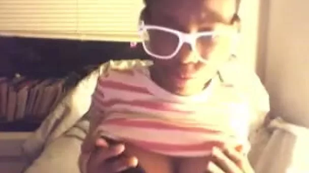 Amateur ebony chick kneads her tits in webcam solo scene